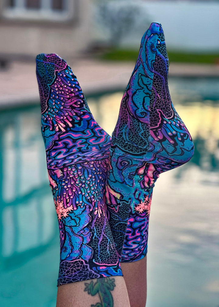 Diver wearing Coral Kaleidoscope dive socks