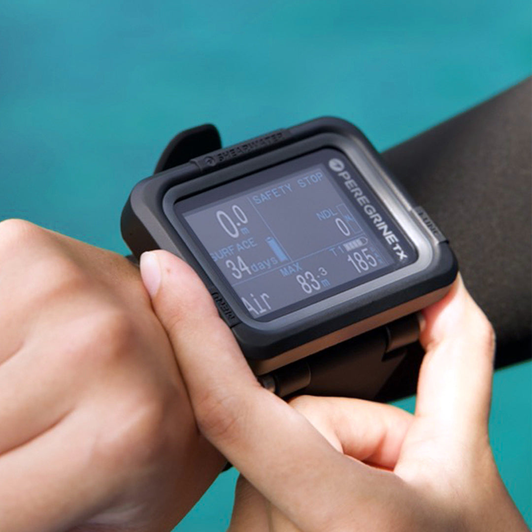 Diver wearing Shearwater Peregrine TX dive computer on wrist