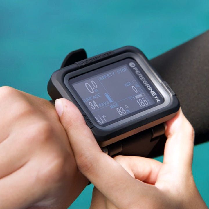 Diver wearing Shearwater Peregrine TX dive computer on wrist