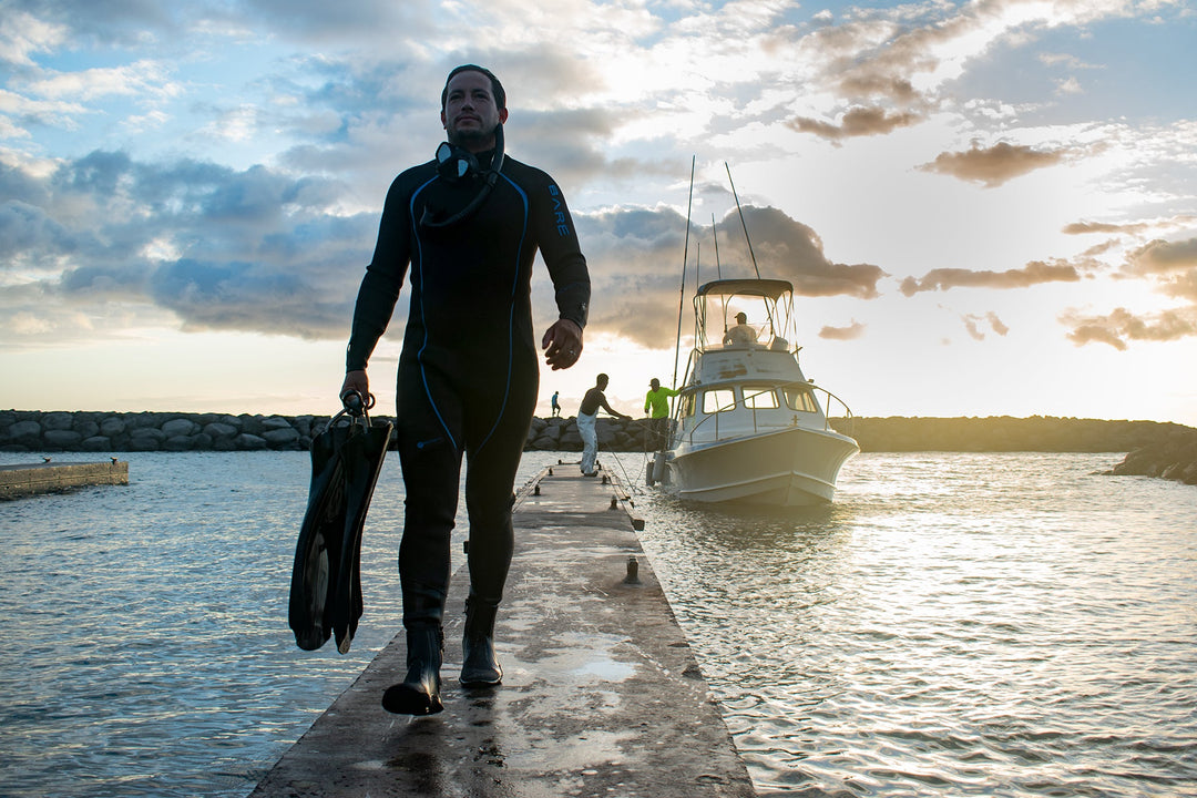 Diver wearing Bare Reactive wetsuit on the boat
