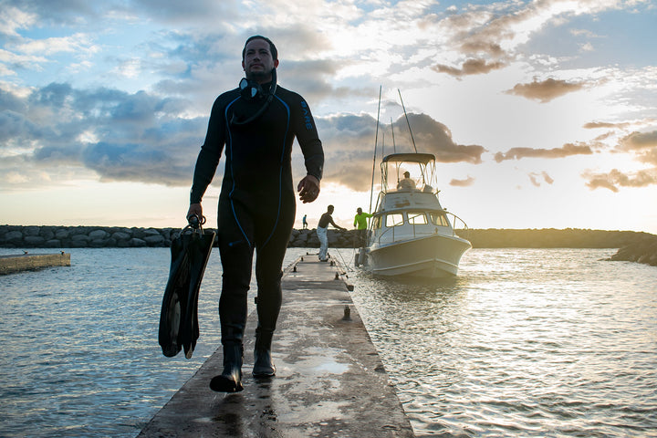 Diver wearing Bare Reactive wetsuit on the boat