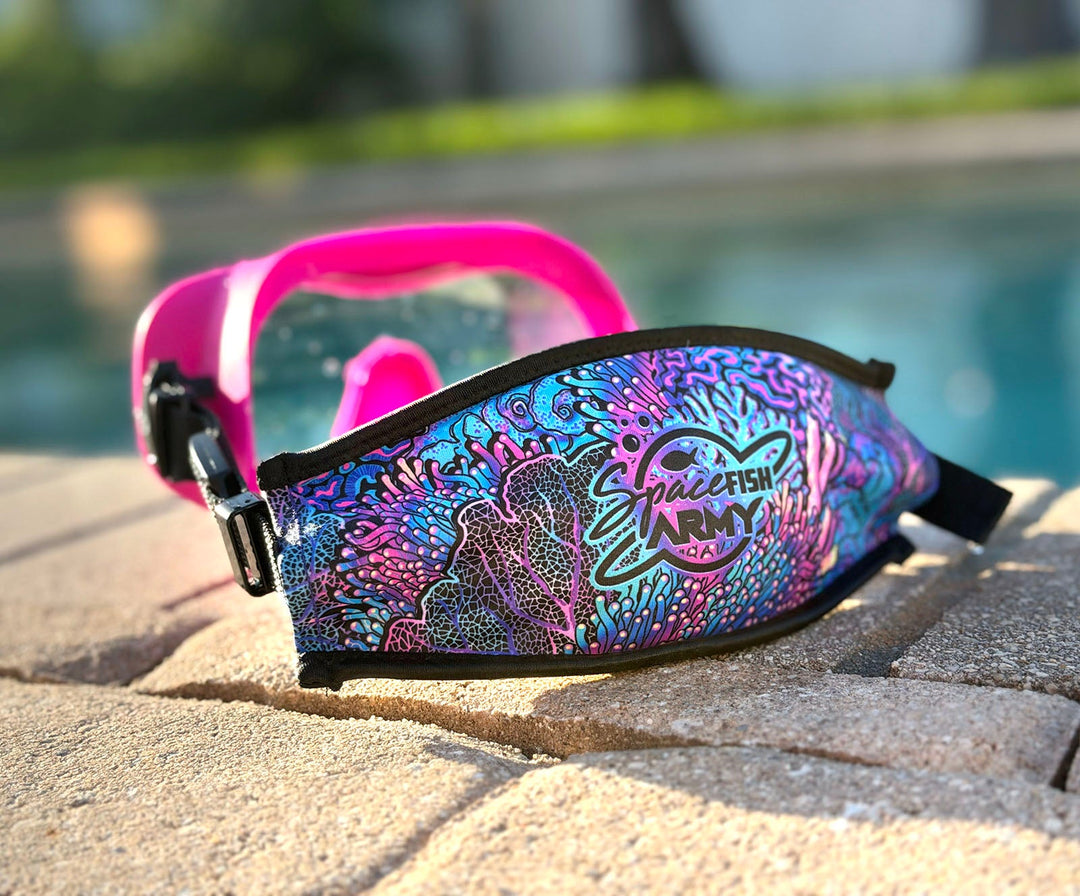 Coral Kaleidoscope mask strap cover on a dive mask